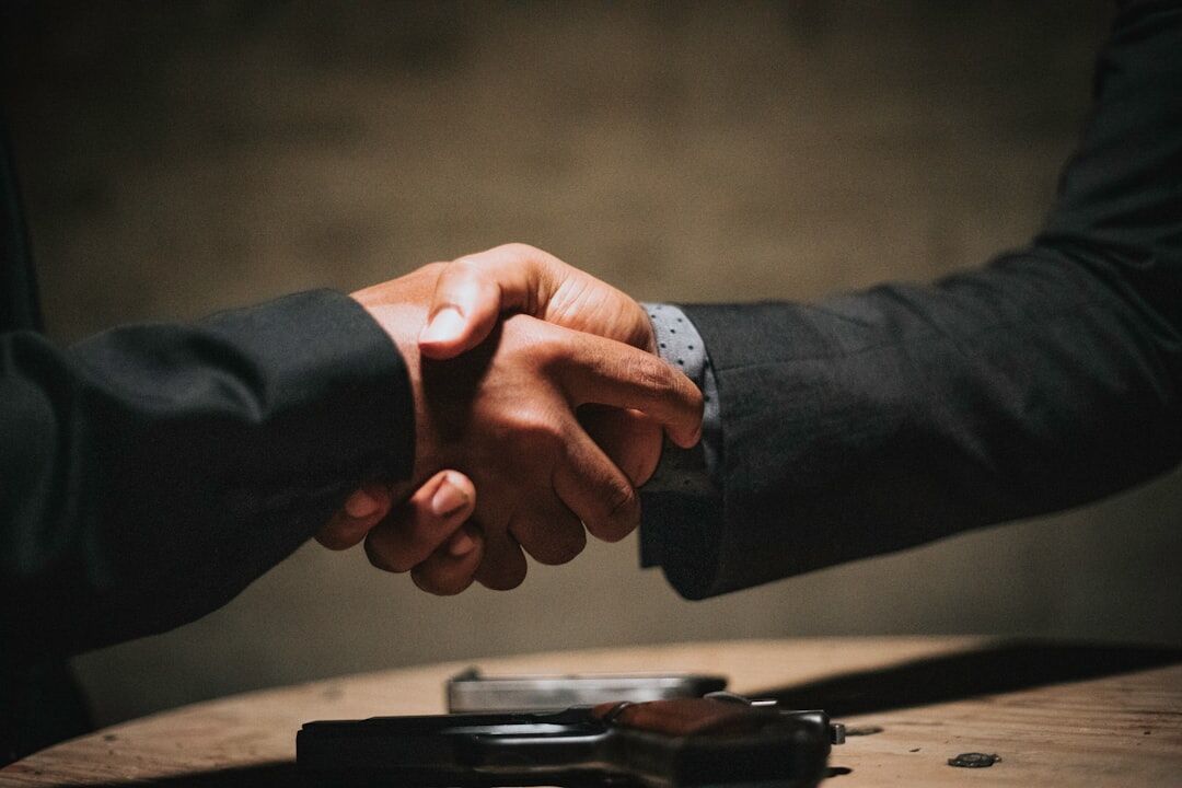 men shaking hands in suit
