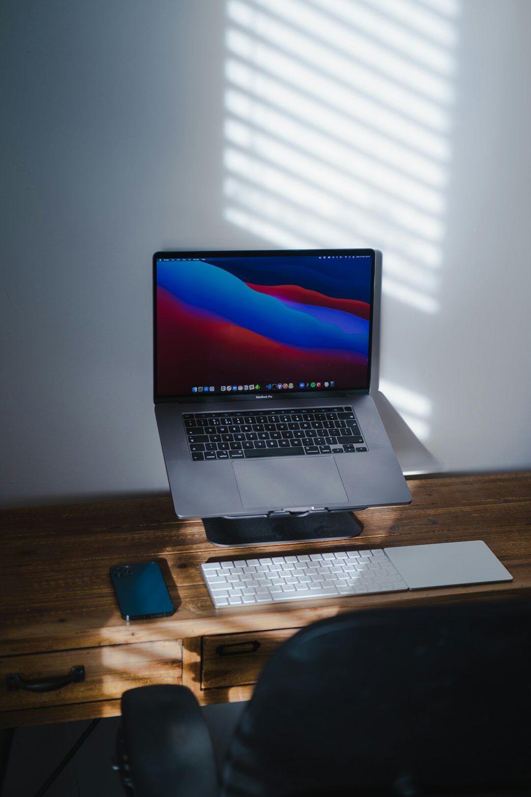 laptop on desk with notes